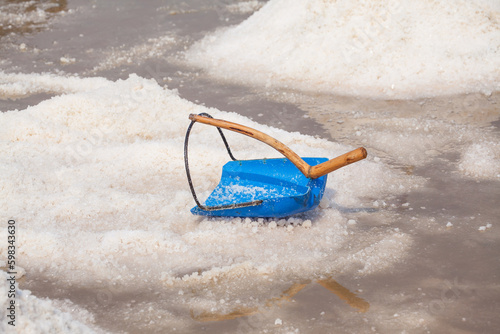 Close up Salt piles with blue lapper in the salt fields  in Thailand
