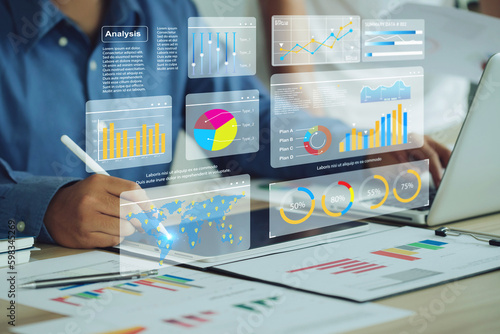 Two analyst works on a laptop showing data business analysis and Data Management System with KPI and metrics connected to the database for technology finance operations Data Analytics Statistics.