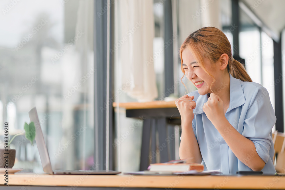 Happy and excited, a young asian woman student or office worker, celebrates achieving her goal of winning an online competition or receiving good news via email by raising hands in euphoria. Happy and excited, a young asian woman student or office worker, celebrates achieving her goal of winning an online competition or receiving good news via email by raising hands in euphoria.