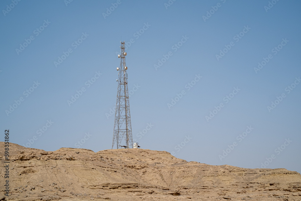 Power pole and antenna in the desert Power pole and antenna in the desert