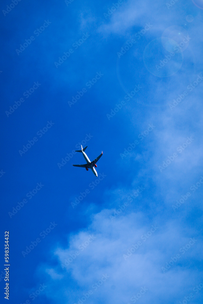 Airplane flying in the blue sky Airplane flying in the blue sky