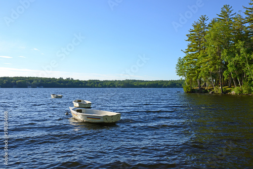 Boats on Messalonskee Lake, body of water in Belgrade Lakes region of Maine, United States © valeriyap