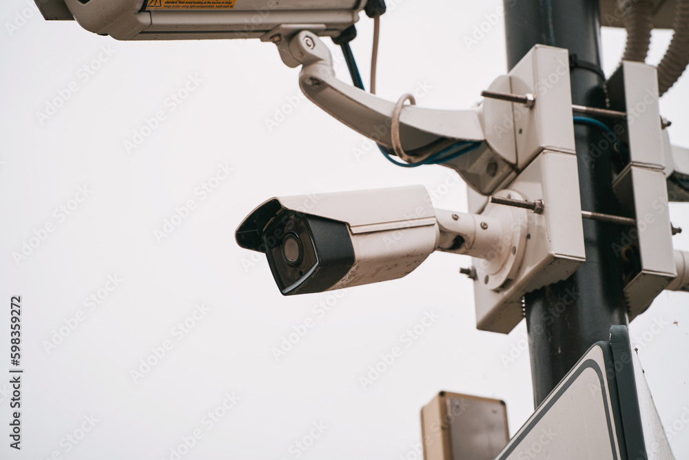 White security camera. CCTV surveillance cam.