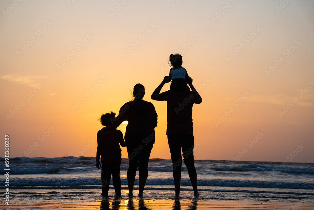 Family on the beach at sunset, beautiful Asian family enjoying the sunset view, freedom relax and holiday concept image,  international day of families