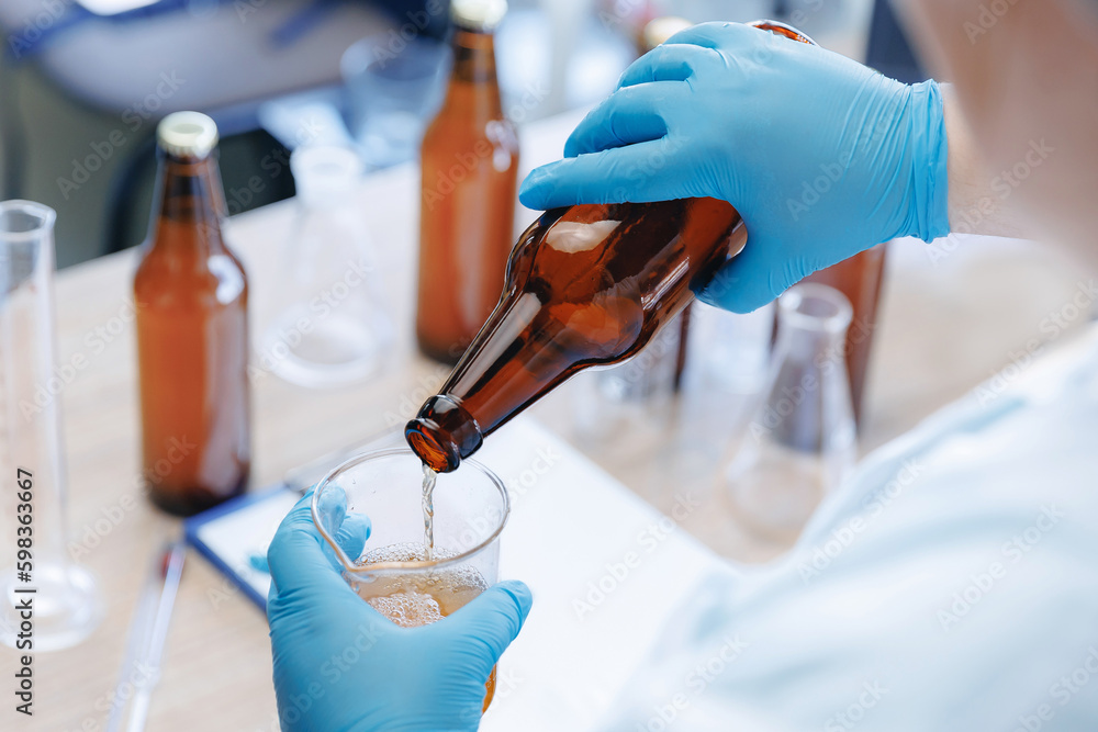 Process test production beer in laboratory, analysis drink in glasses