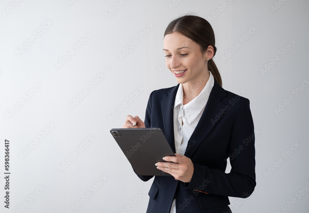 Charming beautiful businesswoman working tablet on white background.