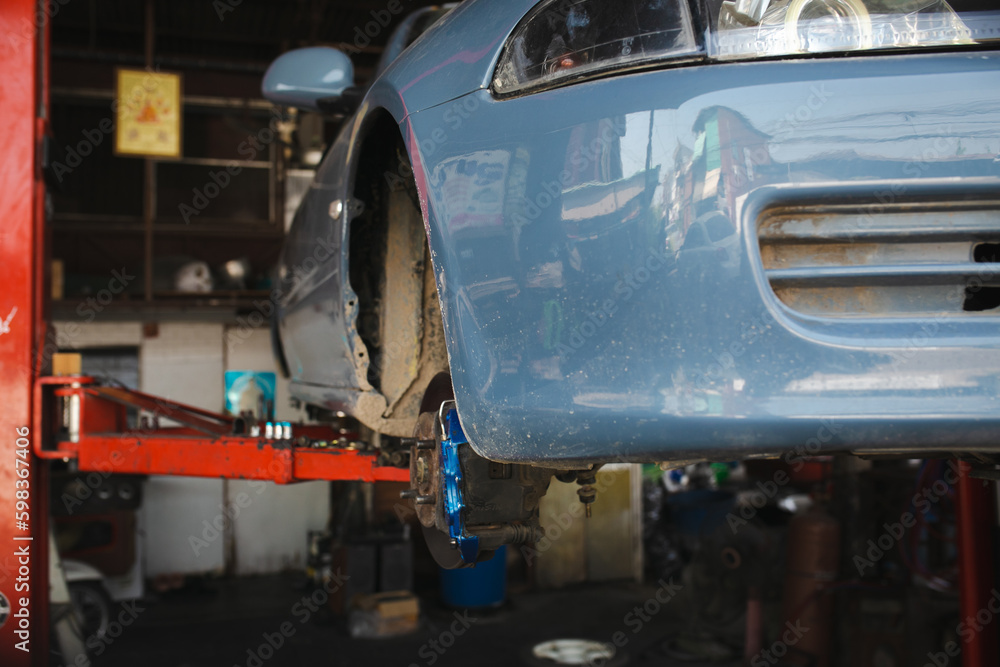 Mechanic in garage, Photo of car car repairing.