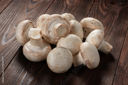 porcini champignon mushrooms on a wooden background close-up