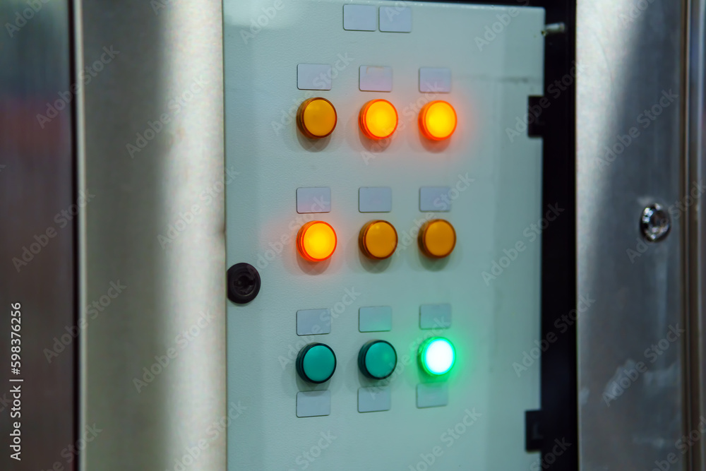 Orange and green buttons glow on the remote control Orange and green buttons glow on the remote control
