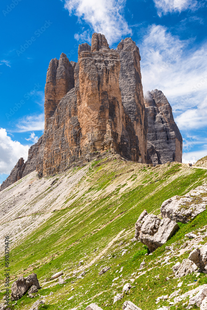 View on Tre Cime di Lavaredo in Dolomites mountains in sunny day. Vertical orientation. Three famous mountain peaks