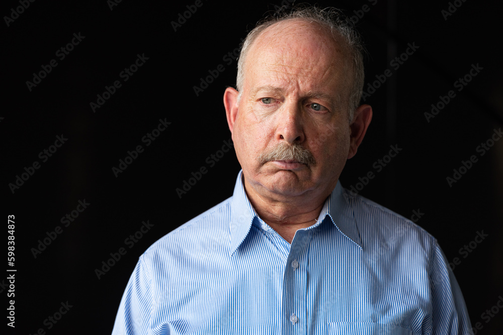 Grey haired senior man with mustache looking sad and stressed Grey haired senior man with mustache looking sad and stressed
