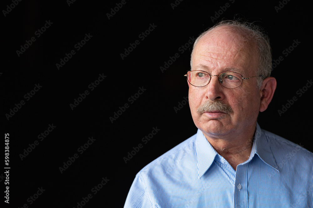 Grey haired senior man with mustache wearing eyeglasses and thinking Grey haired senior man with mustache wearing eyeglasses and thinking