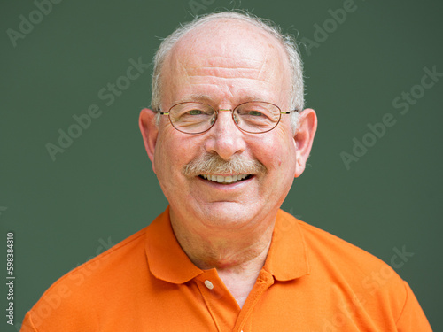 Happy grey haired senior man with mustache wearing eyeglasses