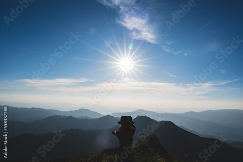 silhouette people with Beautiful landscape view and layers mountains on khao khao chang phueak mountian.Thong Pha Phum National Park's highest mountain is known as Khao Chang Phueak