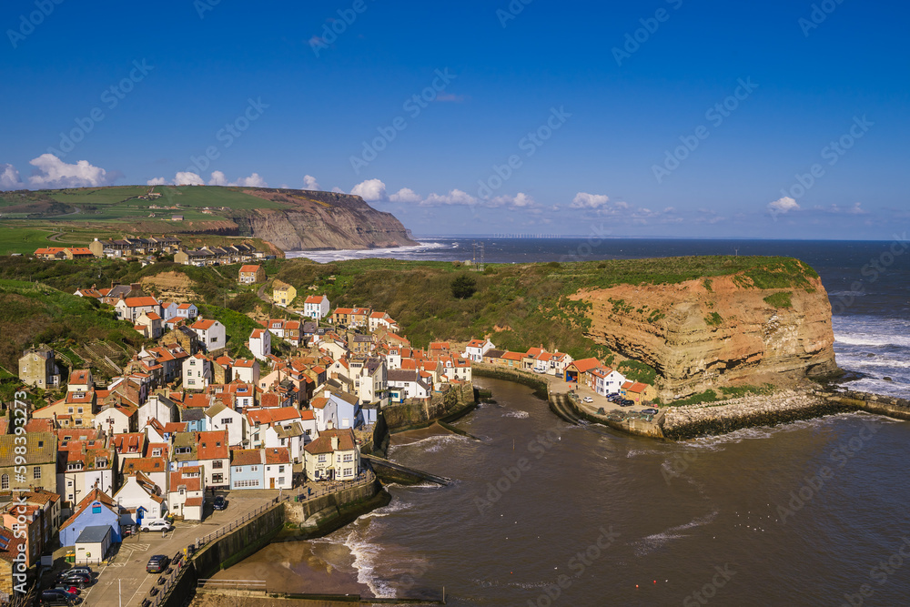 Clifftop view of the cottages of Staithes. This view is from the clifftop just to the south of the village.