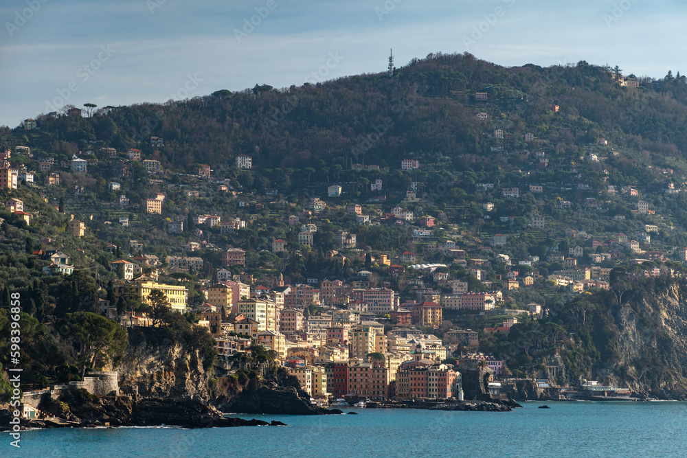 Distant view of Camogli, a small town near Genoa, and surrounding hills. Liguria, Italy