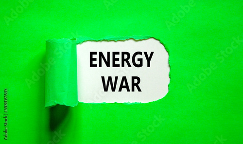 Energy war symbol. Concept words Energy war on beautiful white paper. Beautiful green table green background. Business and Energy war concept. Copy space.
