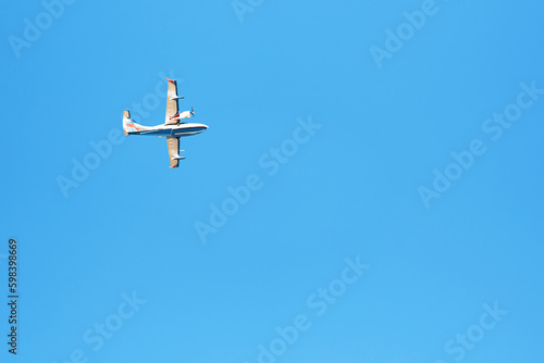 A small white plane against the sky