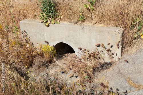 Obraz na plátně Dry culvert for water drainage under roadway.