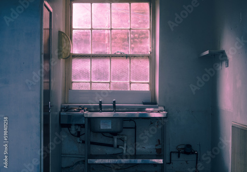 Old abandoned Kitchen with sink in front of a window