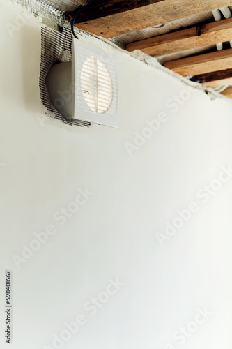 Home ventilation grill. Forced ventilation in the wall under the ceiling.