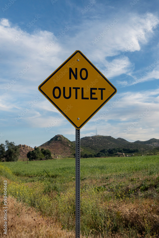 A no outlet road side traffic sign