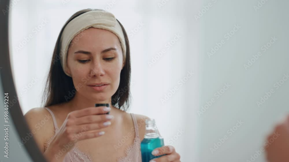 Happy model pouring mouthwash at bathroom close up. Smiling lady rinsing mouth Generative AI Happy model pouring mouthwash at bathroom close up. Smiling lady rinsing mouth Generative AI