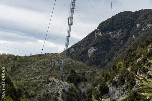 Longest Tibetan bridge in the world located in Castelsaraceno in Italy. The steel bridge spans 580m on a walkway with separate platforms overlooking a breathtaking panorama. photo
