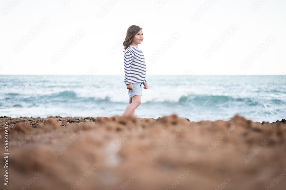 beautiful girl posing by the sea