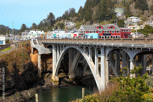 Along the Oregon Coast: The town of Depoe Bay with the bridge over the inlet leading to the harbor.