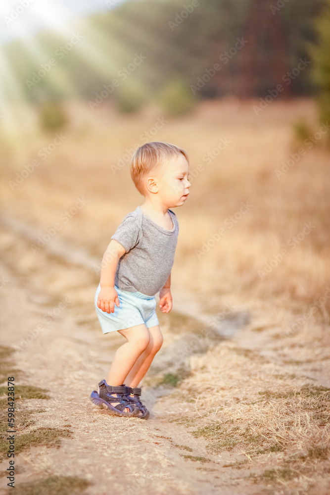 Happy child outdoors in the park playing travel Happy child outdoors in the park playing travel