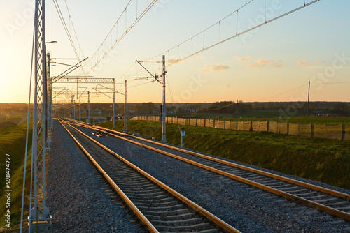 Railroad track during spring evening in countryside