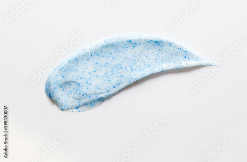Sample texture of toothpaste with calcium hydroxyapatite on a white background. Selective focus, copy space