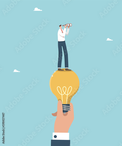 Teamwork and brainstorming, leadership in solving problems and overcoming difficulties, helping to create creative ideas for business, a large hand holding a light bulb with a man looking binoculars.