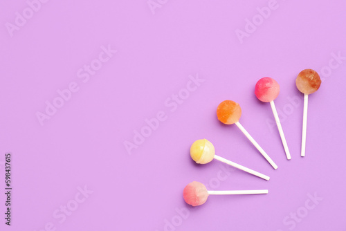 Composition with sweet lollipops on purple background © Pixel-Shot