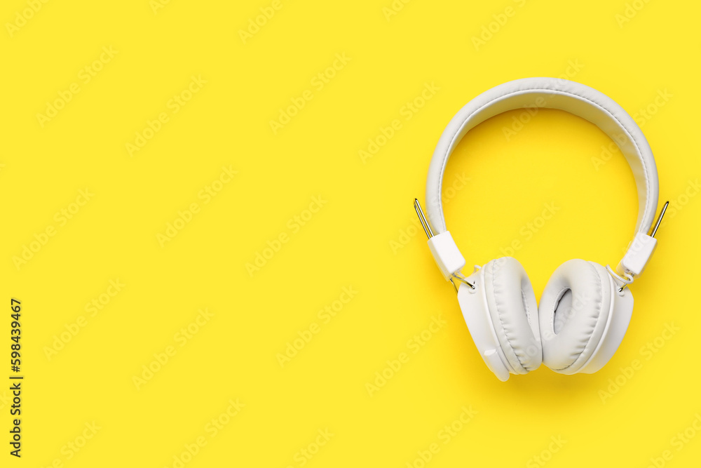 Modern white headphones on yellow background - obrazy, fototapety, plakaty 