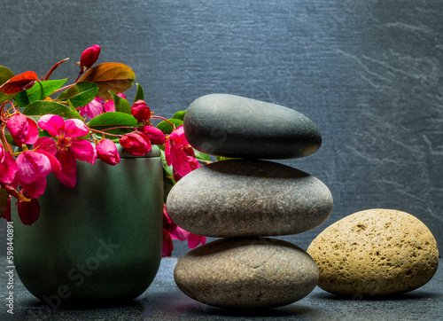 composition with beautiful stones and plants for product presentation podium background.zen stones and flowers with free area for product for podium background.