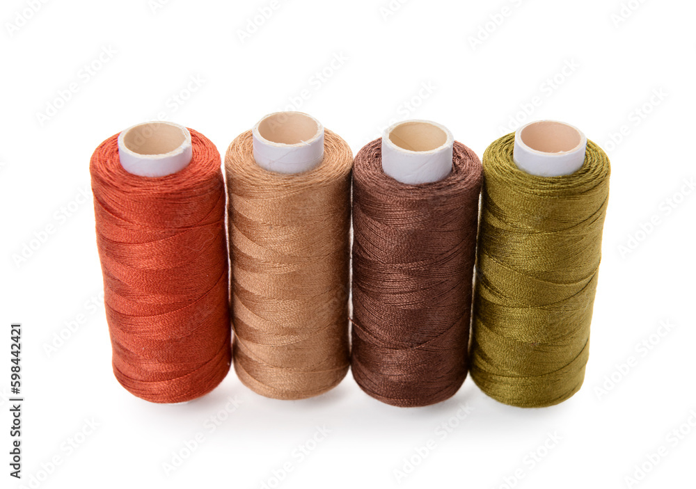 Row of thread spools isolated on white background Row of thread spools isolated on white background