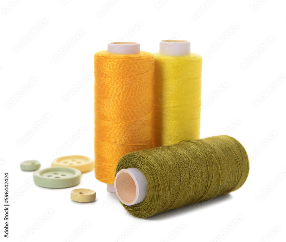 Thread spools and buttons isolated on white background Thread spools and buttons isolated on white background