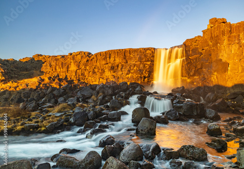 Öxarárfoss Waterfall at sunrise in Thingvellir National Park, Selfoss, Iceland photo