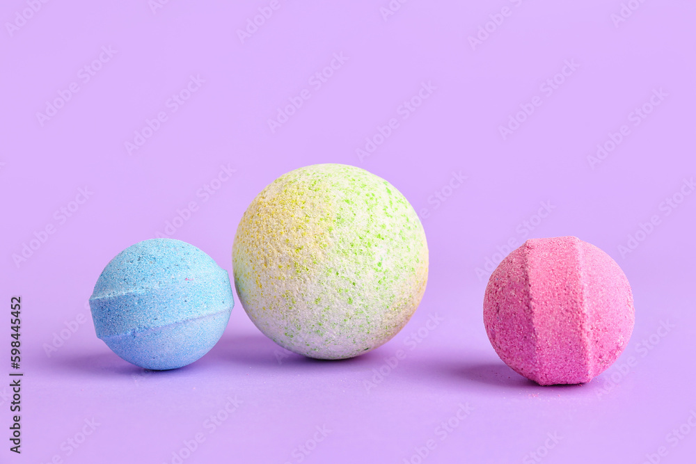 Bath bombs on lilac background Bath bombs on lilac background