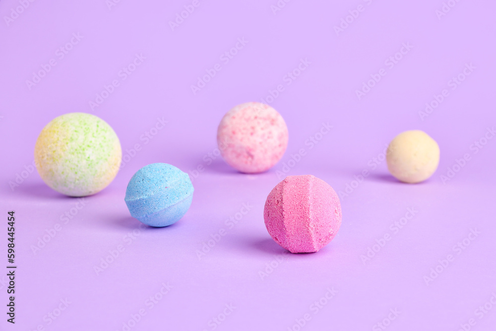 Bath bombs on lilac background Bath bombs on lilac background