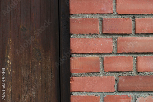red brick wall with a wooden brown door on the background