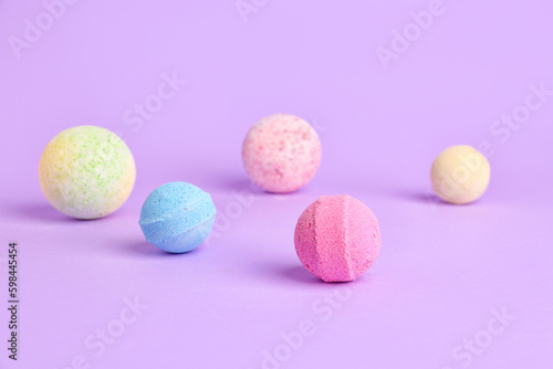 Bath bombs on lilac background