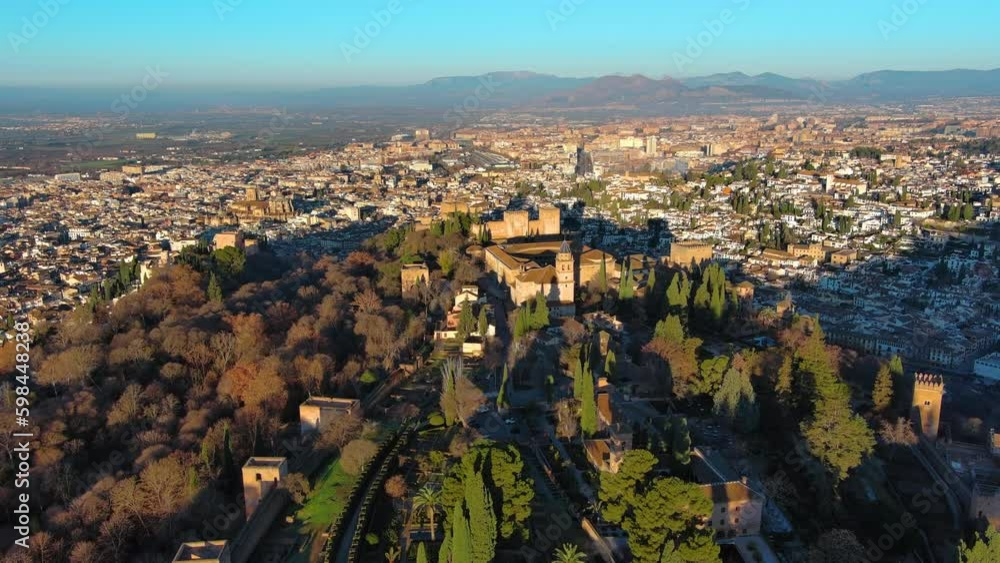 Aerial view of the famous Alhambra palace and fortress in Granada, Andalusia, Spain. It is one of the most famous monuments of Islamic architecture Aerial view of the famous Alhambra palace and fortress in Granada, Andalusia, Spain. It is one of the most famous monuments of Islamic architecture