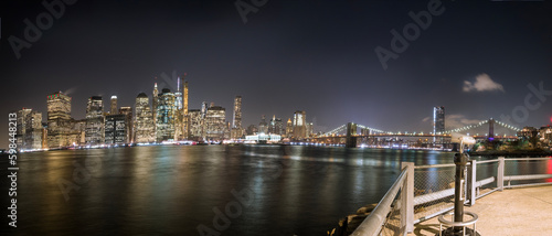Lower Manhattan, its skyline and the Brooklyn Bridge at night, seen from Brooklyn