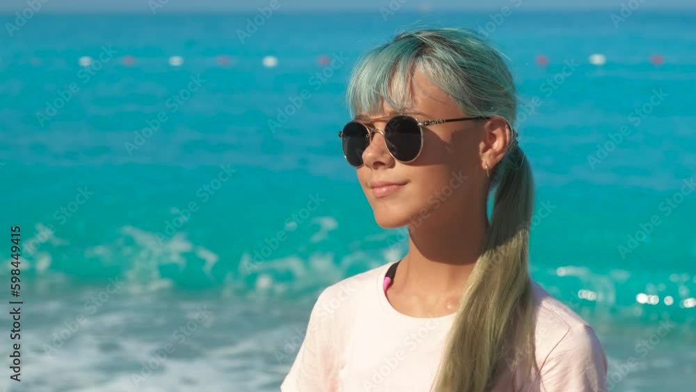 Stylish girl on pebbles shore. A happy stylish young girl have a rest on the white pebbles beach against turquoise ocean waves in the sun rays. Generative AI Stylish girl on pebbles shore. A happy stylish young girl have a rest on the white pebbles beach against turquoise ocean waves in the sun rays. Generative AI