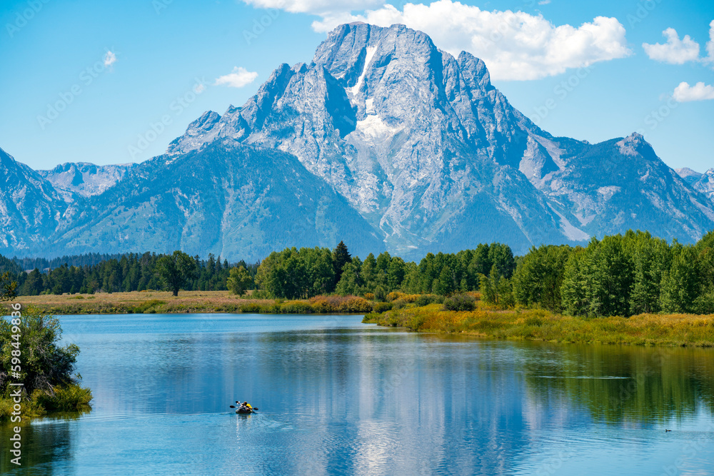Mt Moran over Snake River with canoe, Grand Teton National Park, Wyoming, United States.