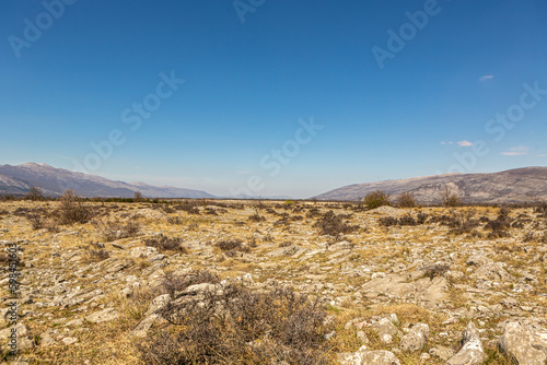Landscape impression of the rough rocks of the Dinara torrent at the border between Croatia and Bosnia Herzegovina in early spring during a sunny day photo