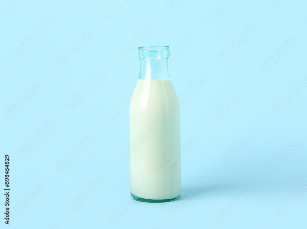 Bottle of milk on light blue background Bottle of milk on light blue background